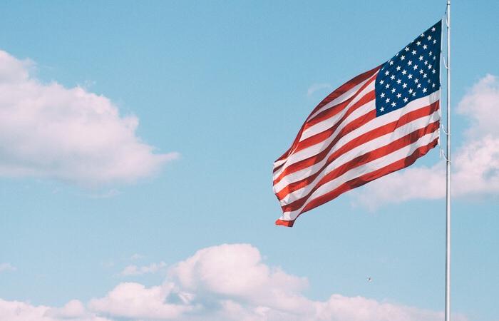 U.S. flag blowing in the wind.